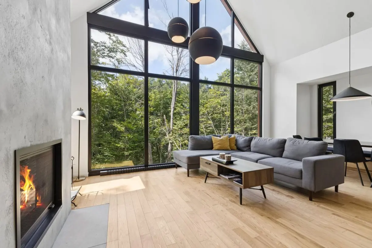 Reference chalet living room with forest views